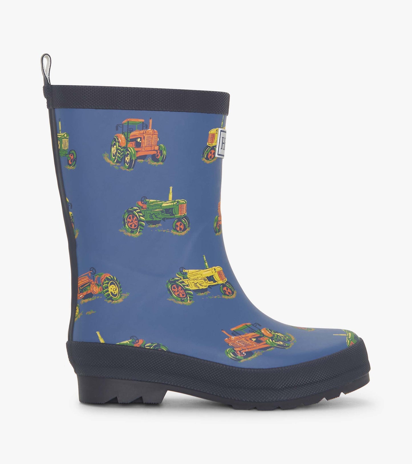 Matte blue rain boots featuring colorful tractor patterns, designed for boys, with a sturdy sole and pull tab.