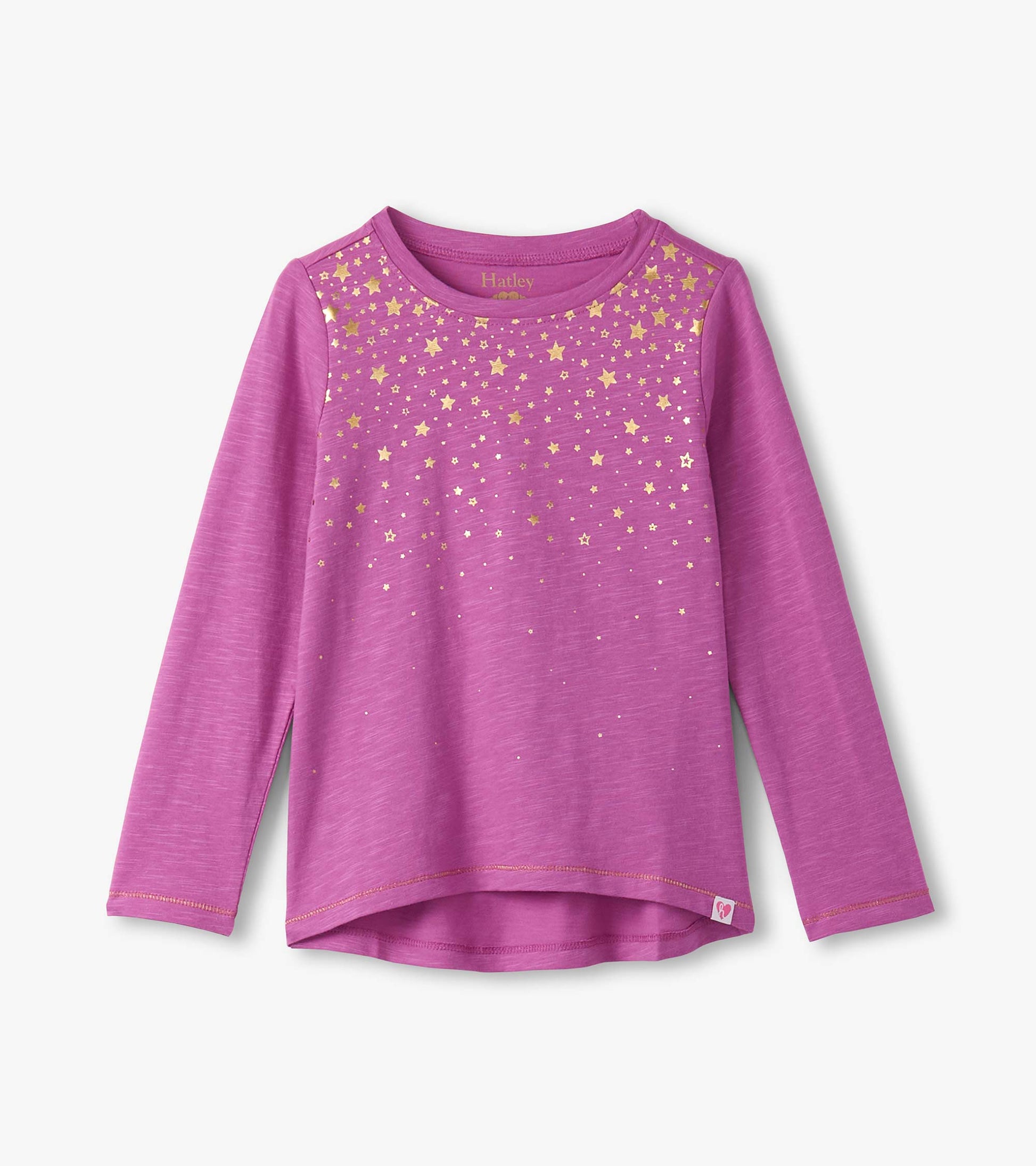 Long sleeve pink graphic tee featuring a gold star pattern across the front, with a rounded neckline and side slits.