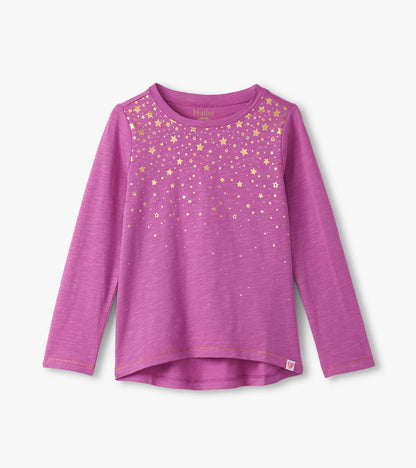 Long sleeve pink graphic tee featuring a gold star pattern across the front, with a rounded neckline and side slits.