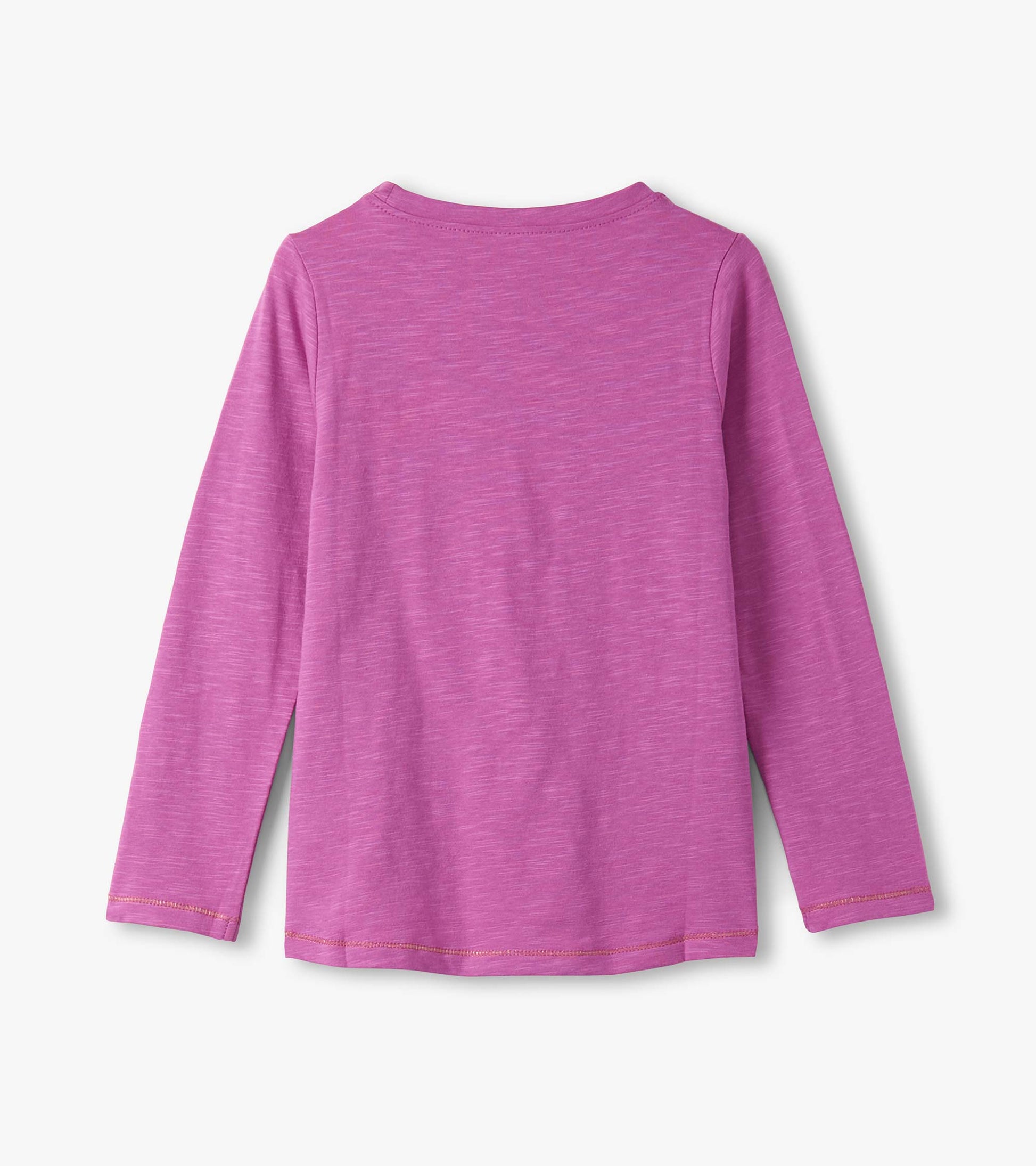 Long sleeve graphic tee in a vibrant pink color with a soft texture, featuring a classic crew neckline.