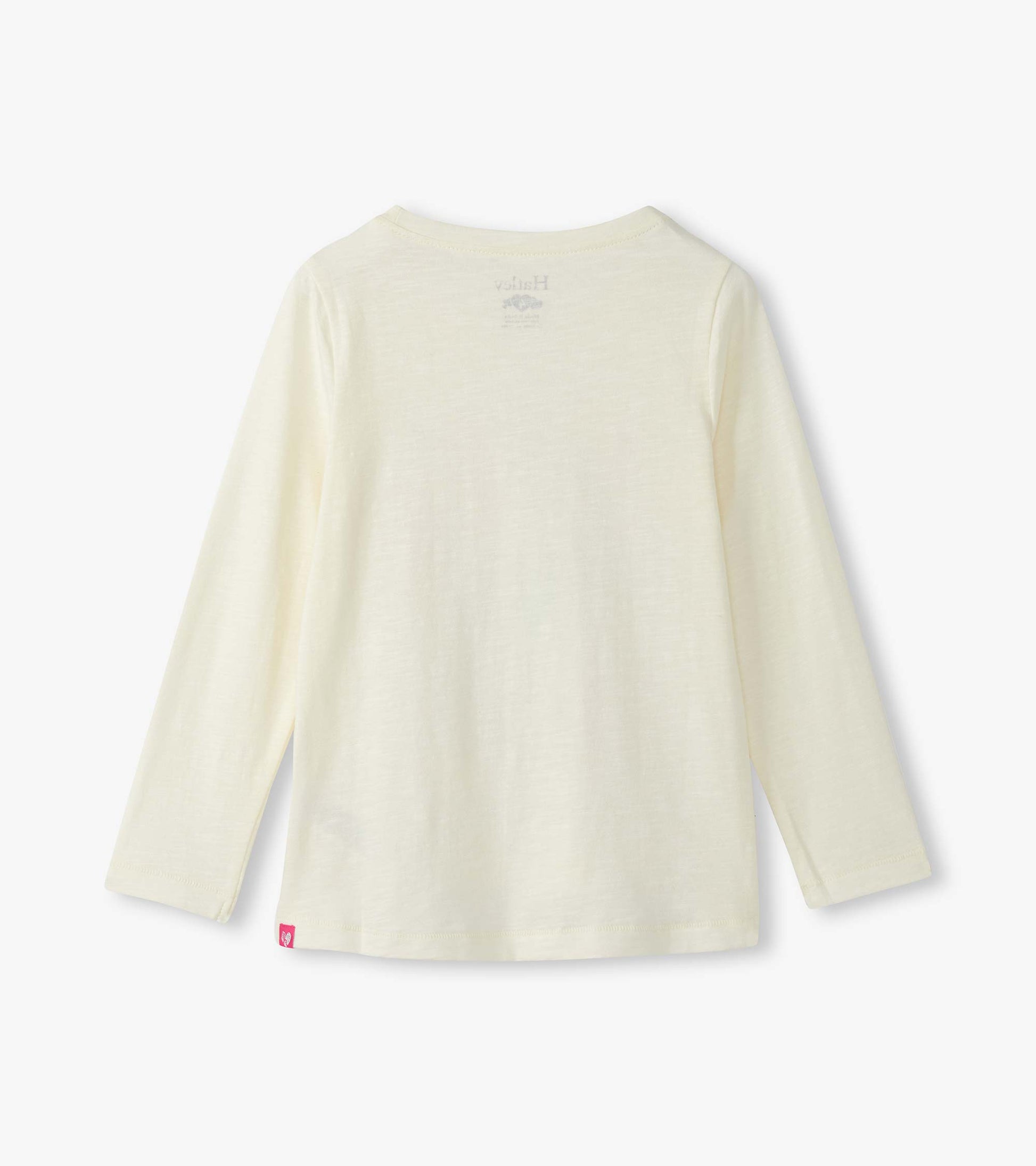 Light cream long sleeve graphic tee with a soft texture and a round neckline, featuring a small logo on the back.
