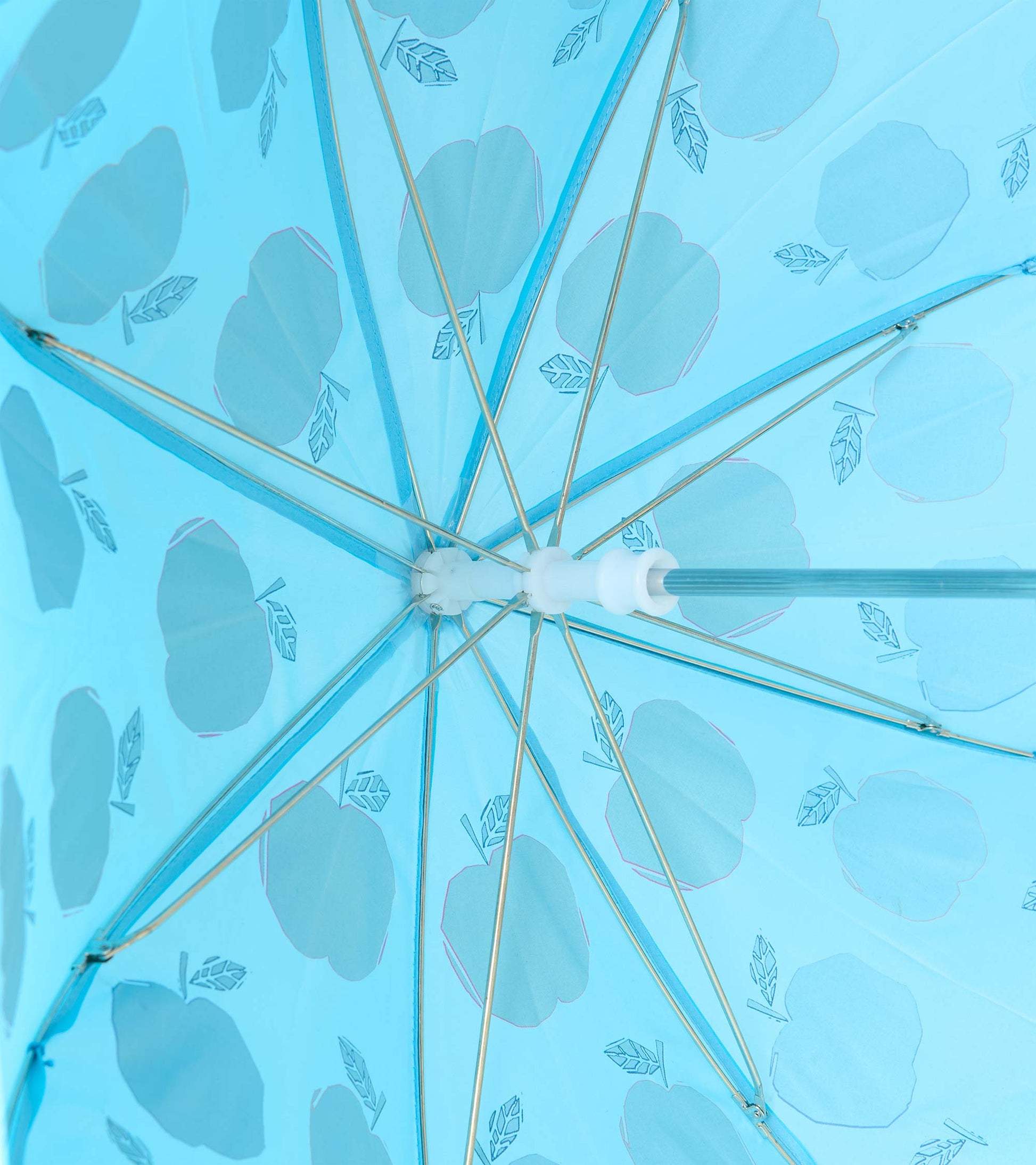 Interior view of blue umbrella showing metal ribs and pale apple print