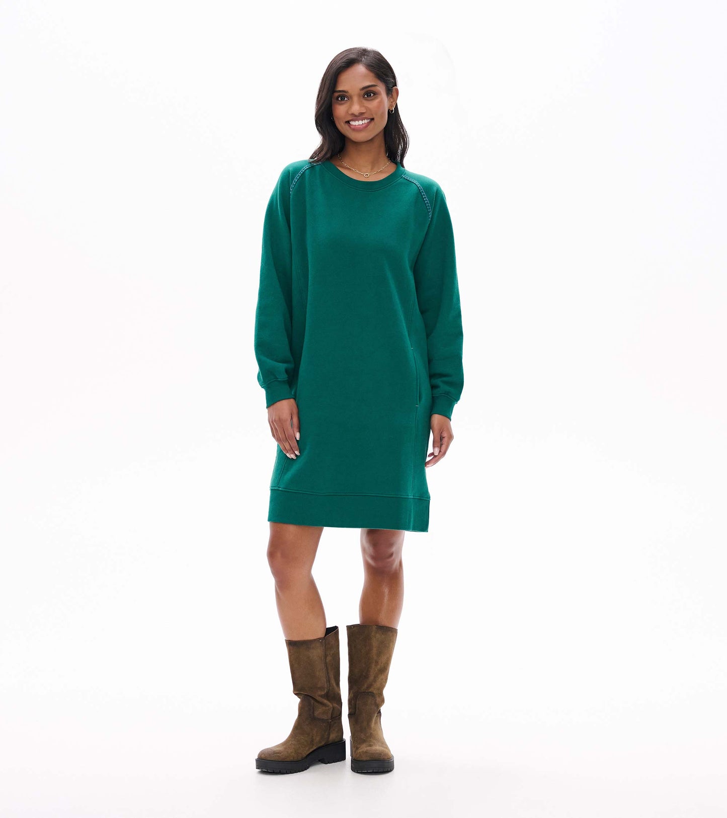 Front view of aventurine green sweatshirt dress with long sleeves, side pockets and ribbed hem