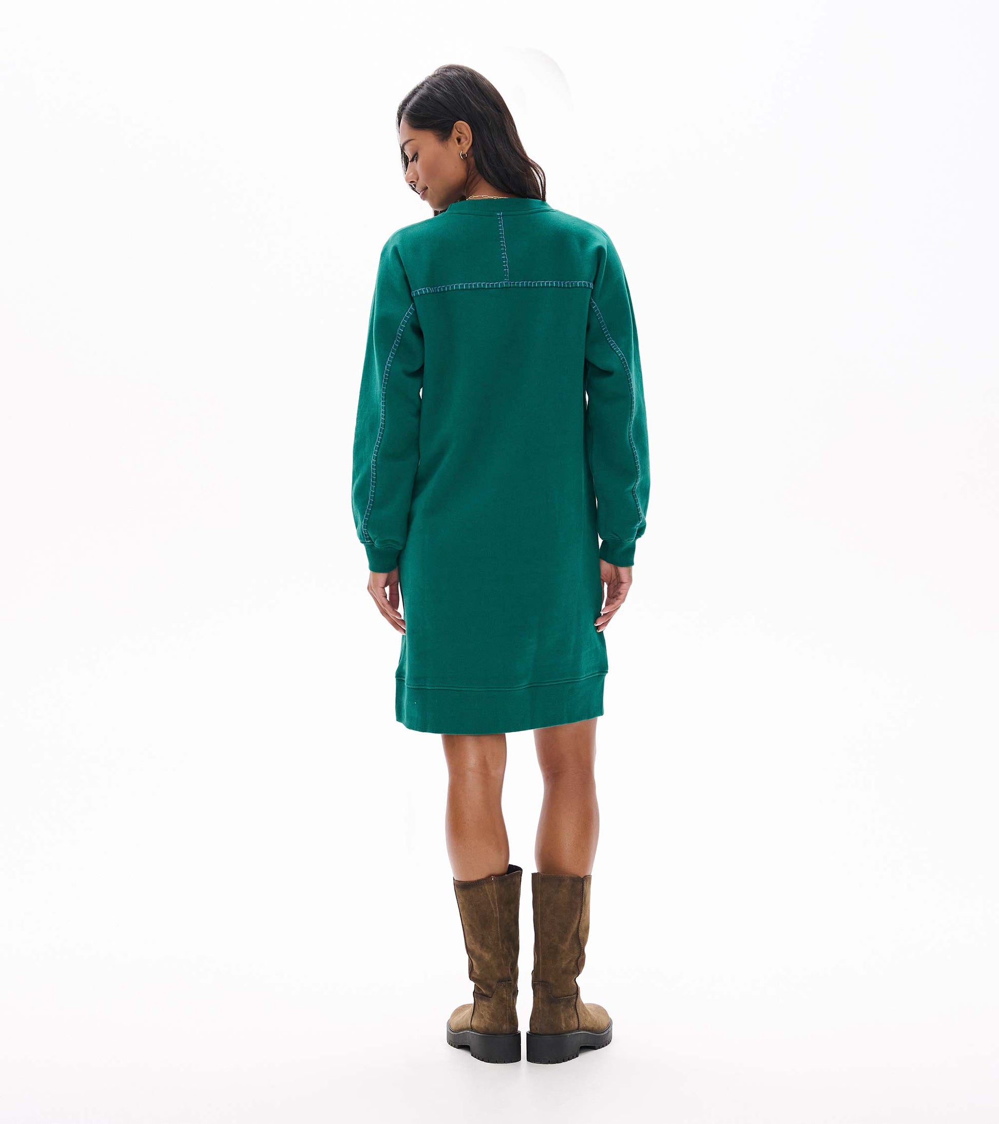 Back view of aventurine green sweatshirt dress with contrast stitching and ribbed cuffs and hem