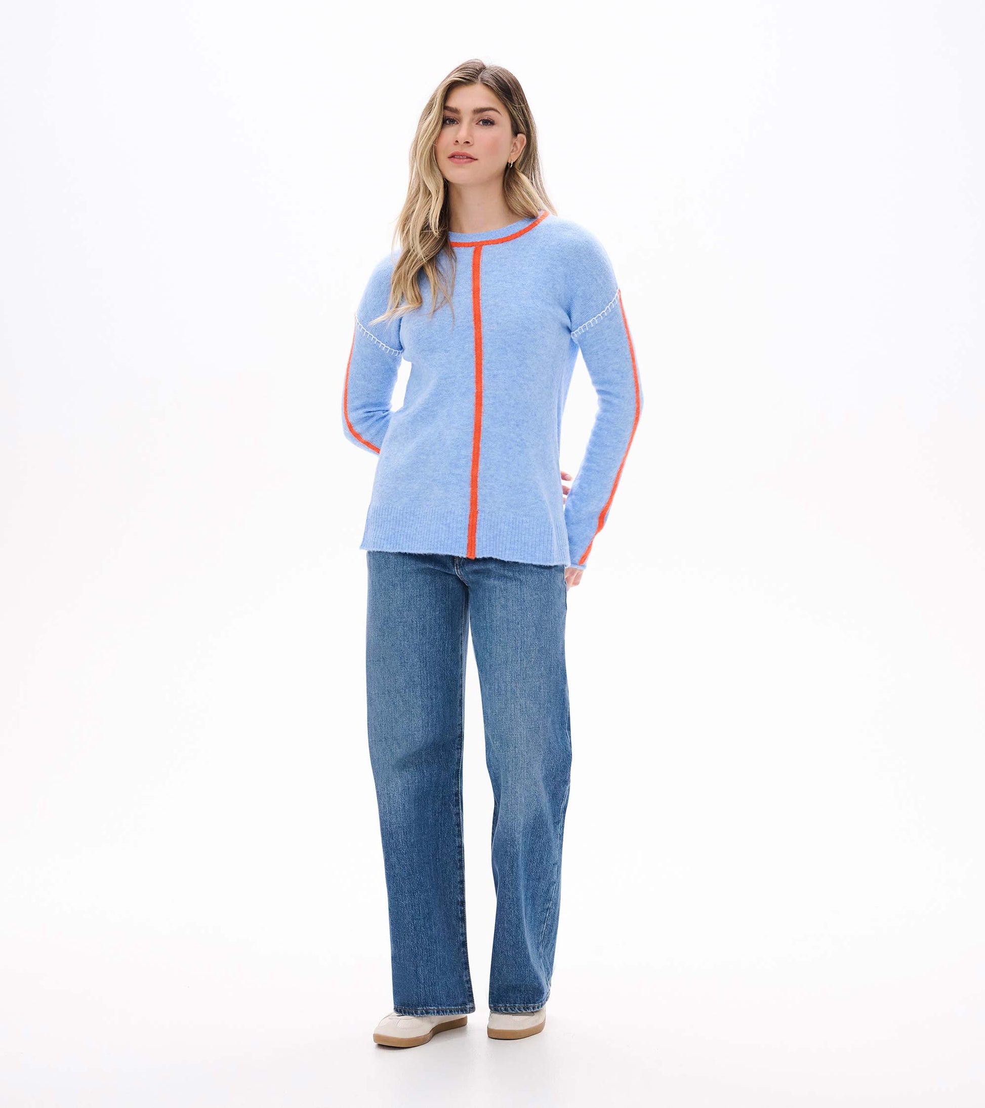Full front view of Maeve sweater in azure blue with orange center seam and sleeve stripes