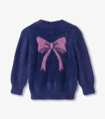 Back view of fuzzy blue cardigan with large pink bow design