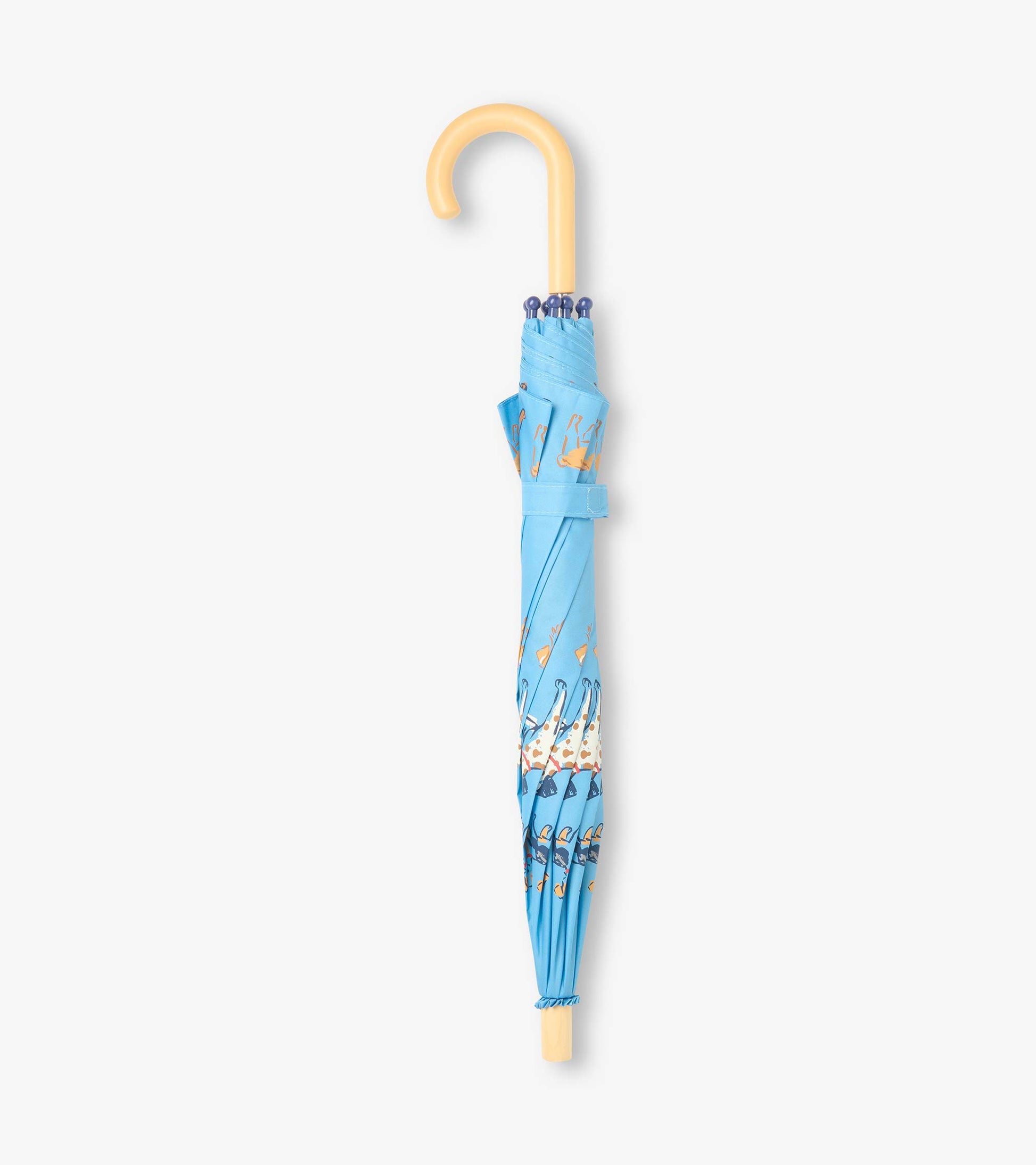Closed blue umbrella with dog print, curved pale handle, and matching wrap strap