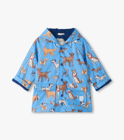 Front view of blue snap rain coat with hood, dog print, flap pockets, and dark blue lining