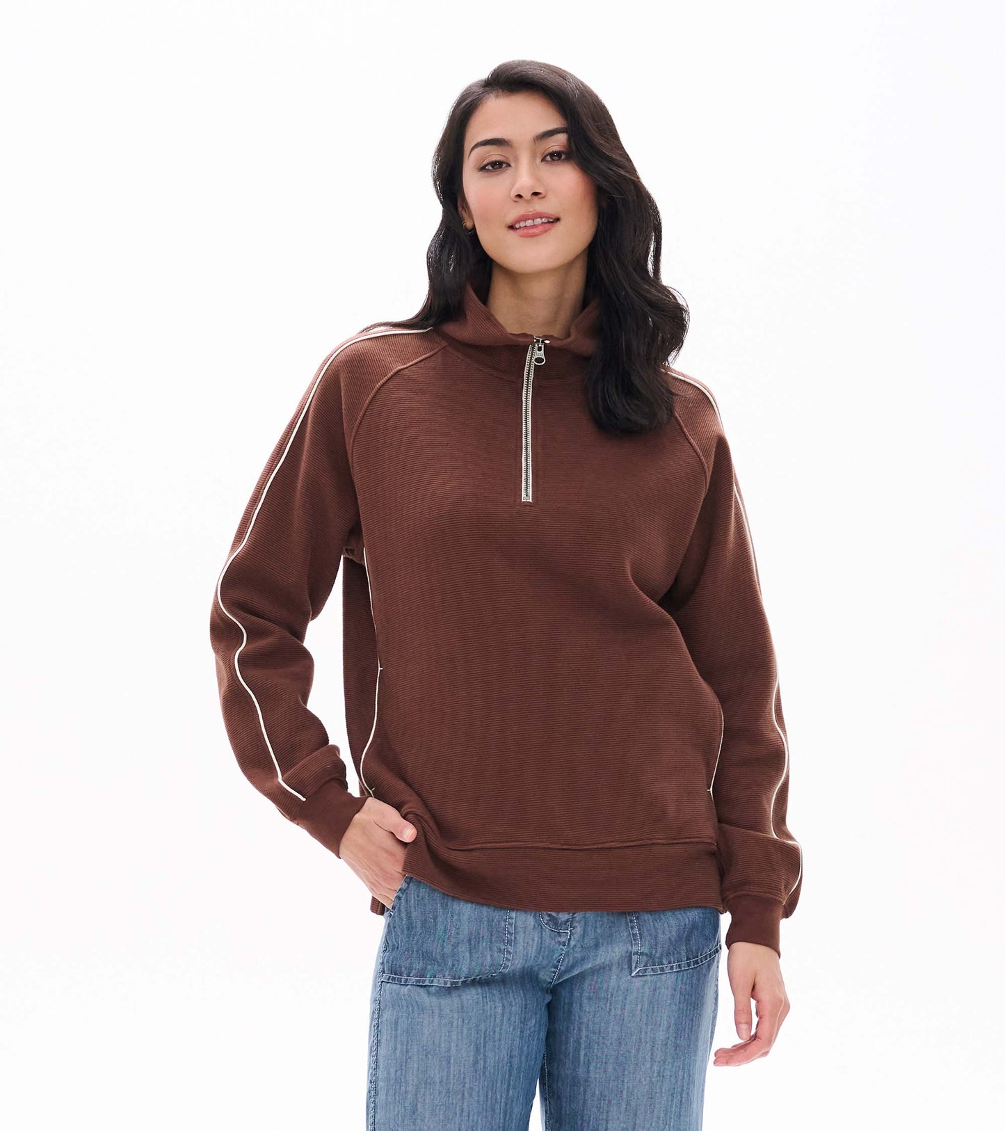 Front view of fondue fudge brown 1/4 zip top with stand collar and white piping along the sleeves