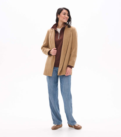 Fondue fudge brown 1/4 zip top layered under a camel coat, shown from the front