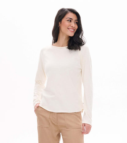 Front view of cream raglan sleeve tee with long sleeves and a wide neckline, shown on model