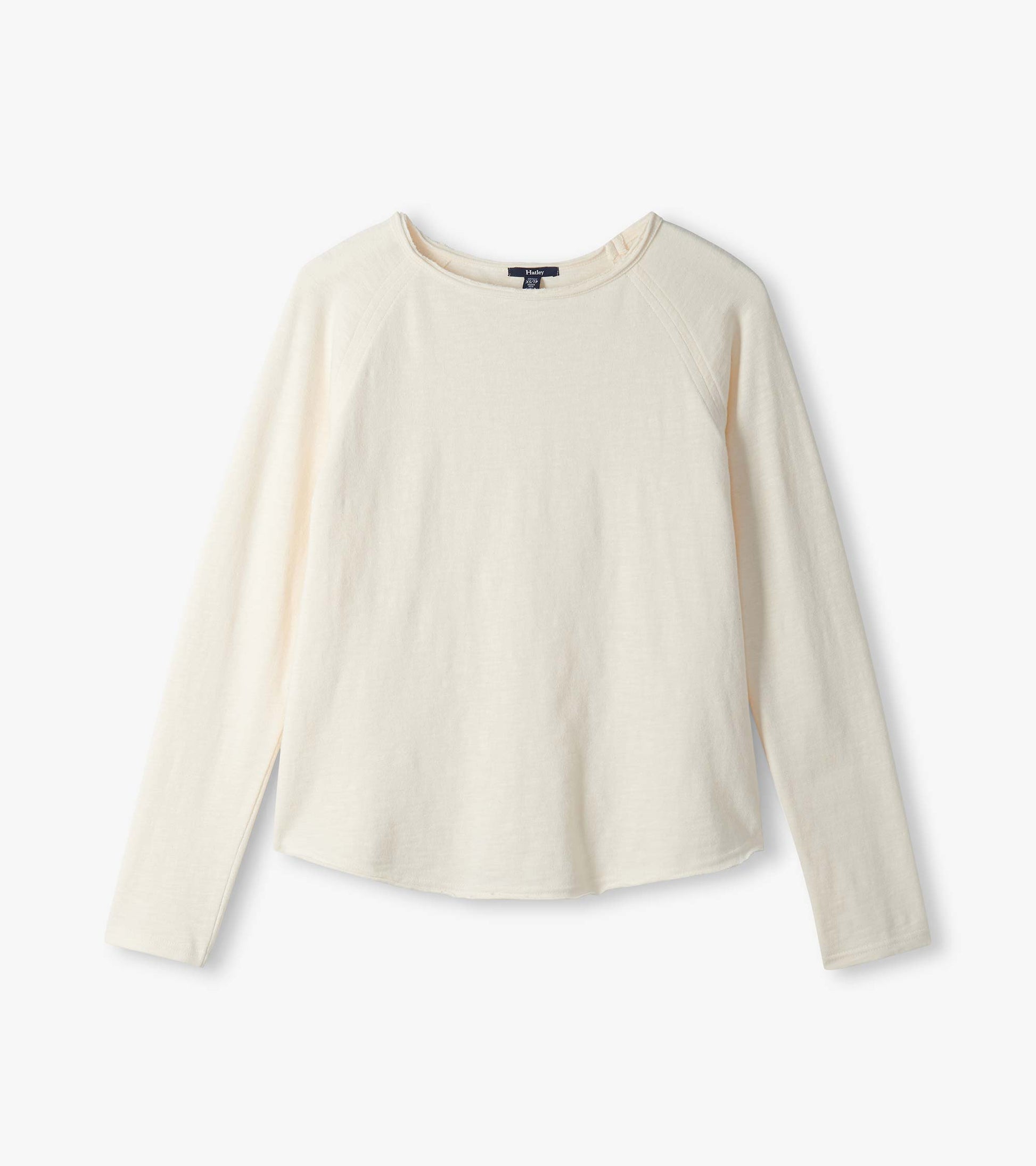 Cream raglan sleeve tee laid flat with long sleeves and a wide neckline