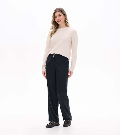 Front angled view of black wide-leg pants with a two-button waist, worn with a cream sweater