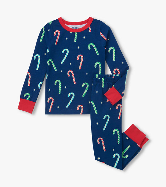 Two-piece boys pajama set in navy with colorful candy cane print and red trim at the neck, cuffs, and ankles
