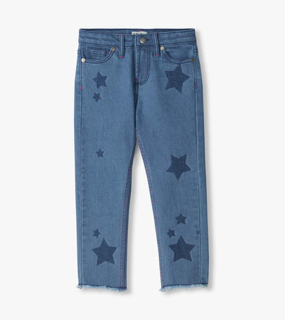 Front view of blue slouchy jeans with dark star print, five-pocket styling, and frayed hems