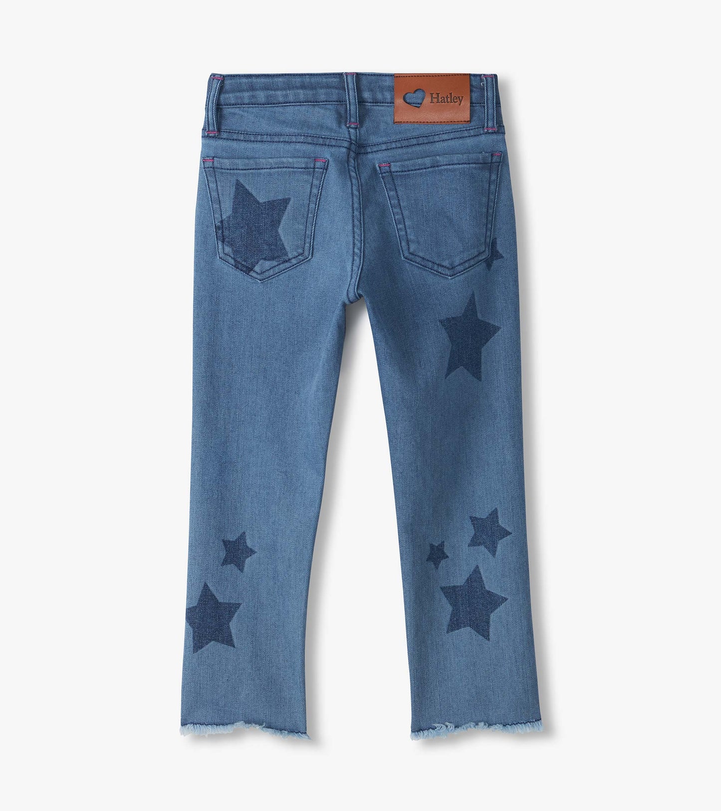 Back view of blue slouchy jeans with dark star print, back pockets, frayed hems, and visible Hatley patch