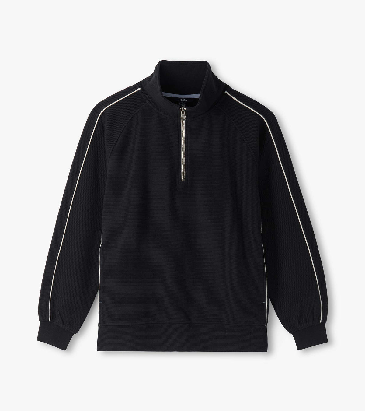 Black 1/4 zip knit top laid flat with stand collar, ribbed hem, and white piping on raglan sleeves