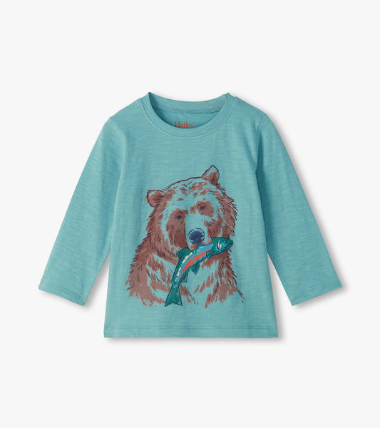Turquoise long sleeve crew neck tee with a brown bear and fish graphic on the front