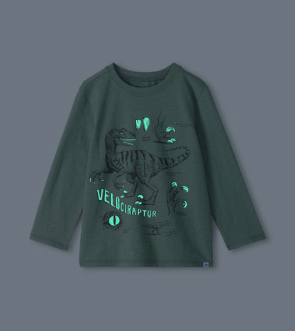 Sage green boys long-sleeve T-shirt with glowing velociraptor graphic details shown in the dark