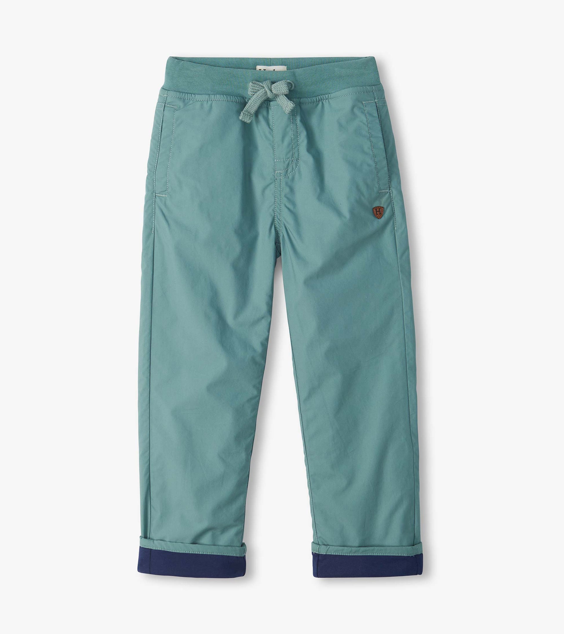 Green pull-on boys pants with drawstring waist, side pockets, and navy cuffed hems