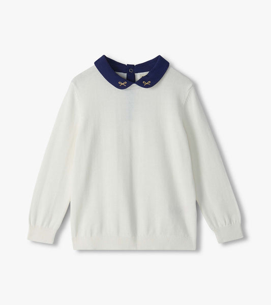 Cream long-sleeve sweater with a navy Peter Pan collar and small embroidered bow details
