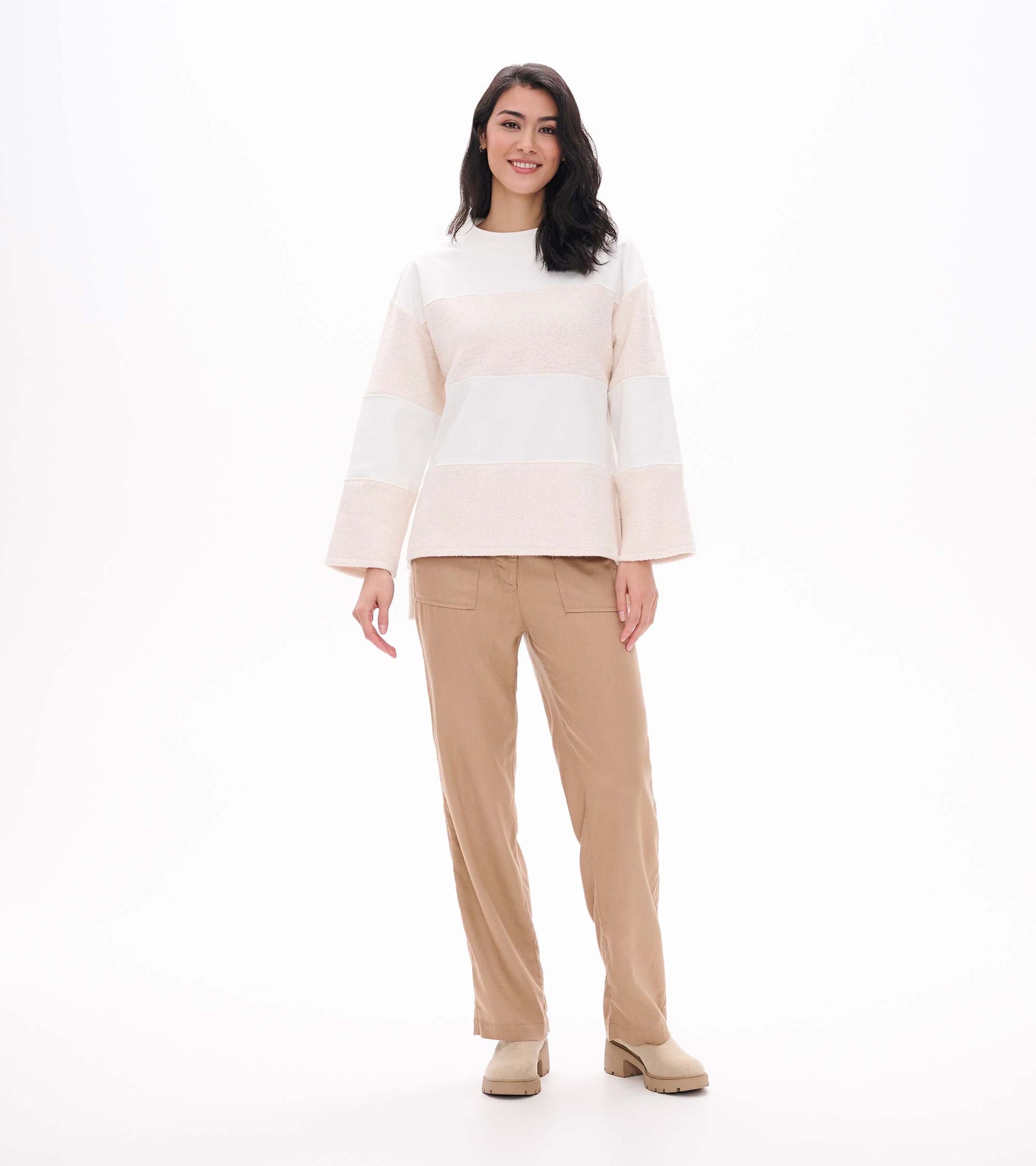 Full front view of oatmeal long sleeve top with wide sleeves and textured horizontal stripe panels