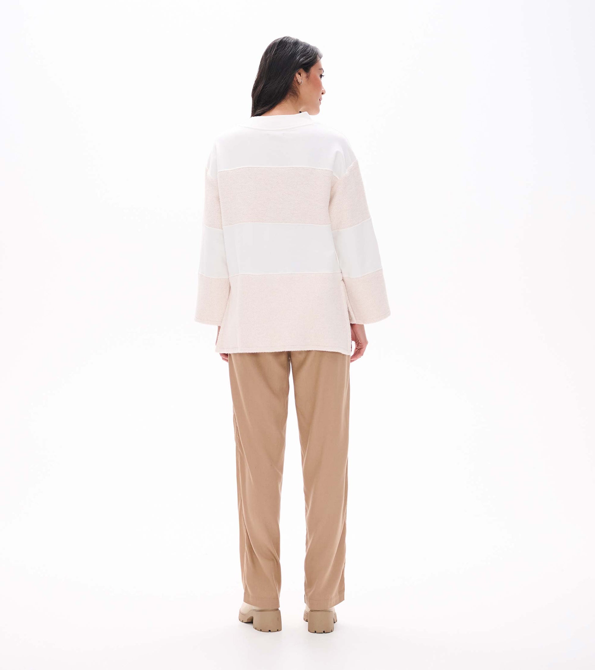 Back view of oatmeal long sleeve top with textured horizontal stripe panels and relaxed fit
