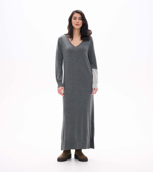 Front view of charcoal melange maxi sweater dress with V-neck, side slit, and contrast light gray sleeve panel