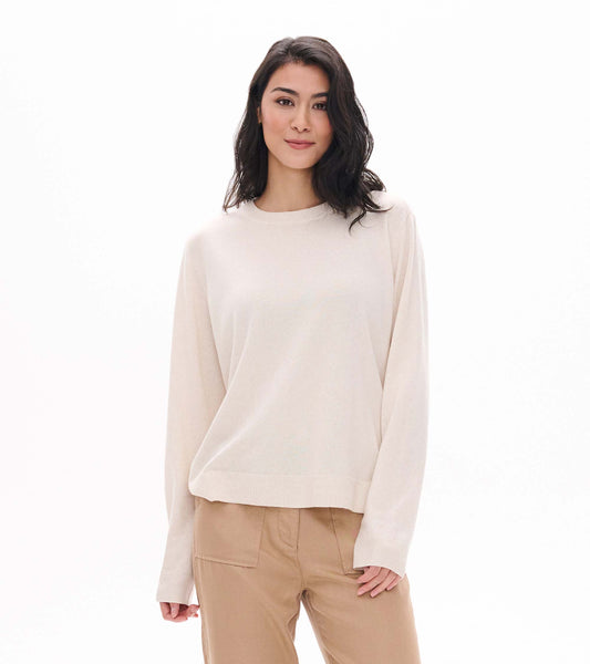Cream melange boyfriend sweater with crew neck and ribbed trim, shown on model from front