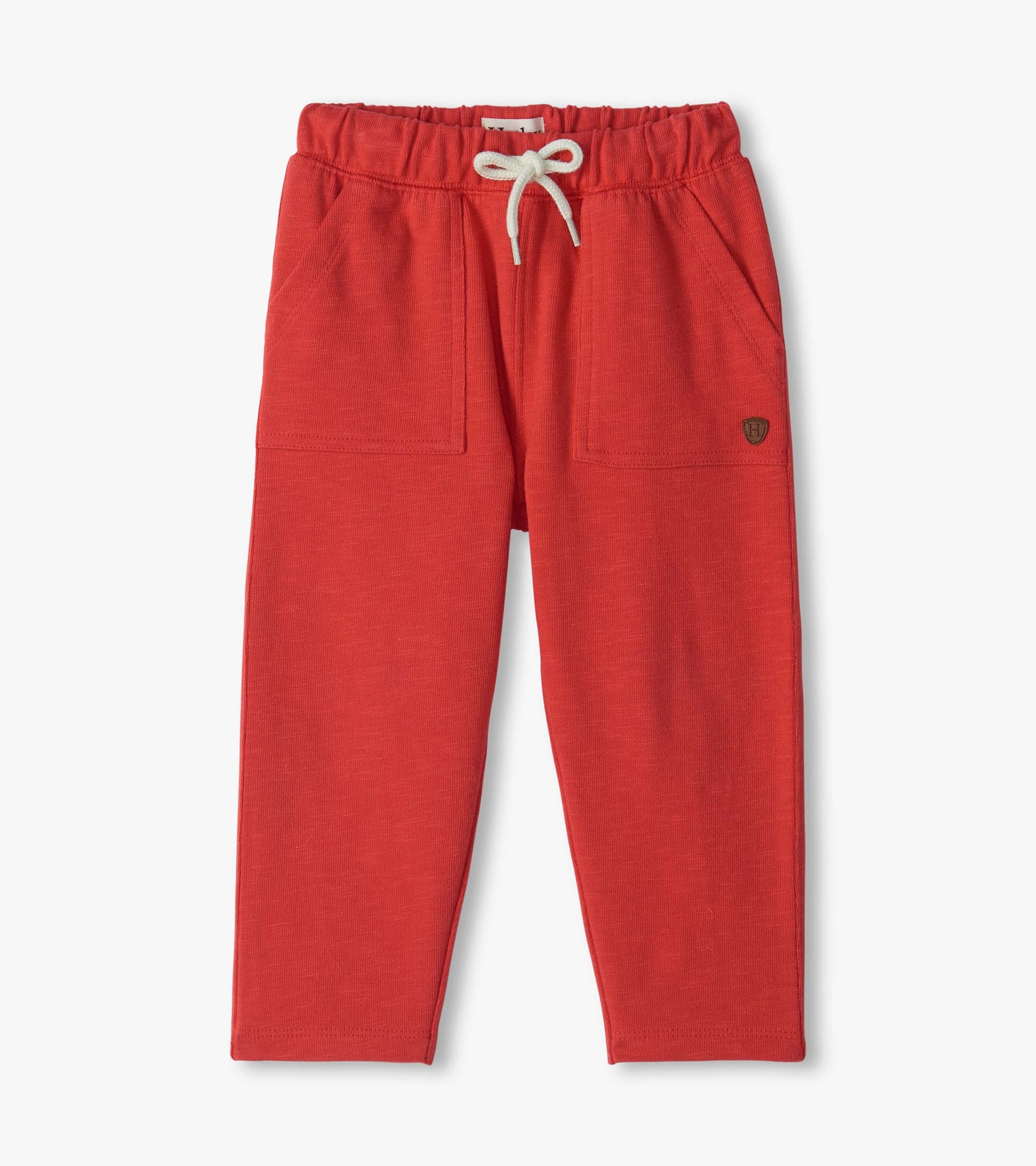 Infant pull-on pants in chrysanthemum red with elastic waistband, white drawstring, and front patch pockets