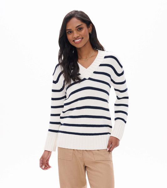 Front view of cream V-neck sweater with navy horizontal stripes and ribbed hem and cuffs