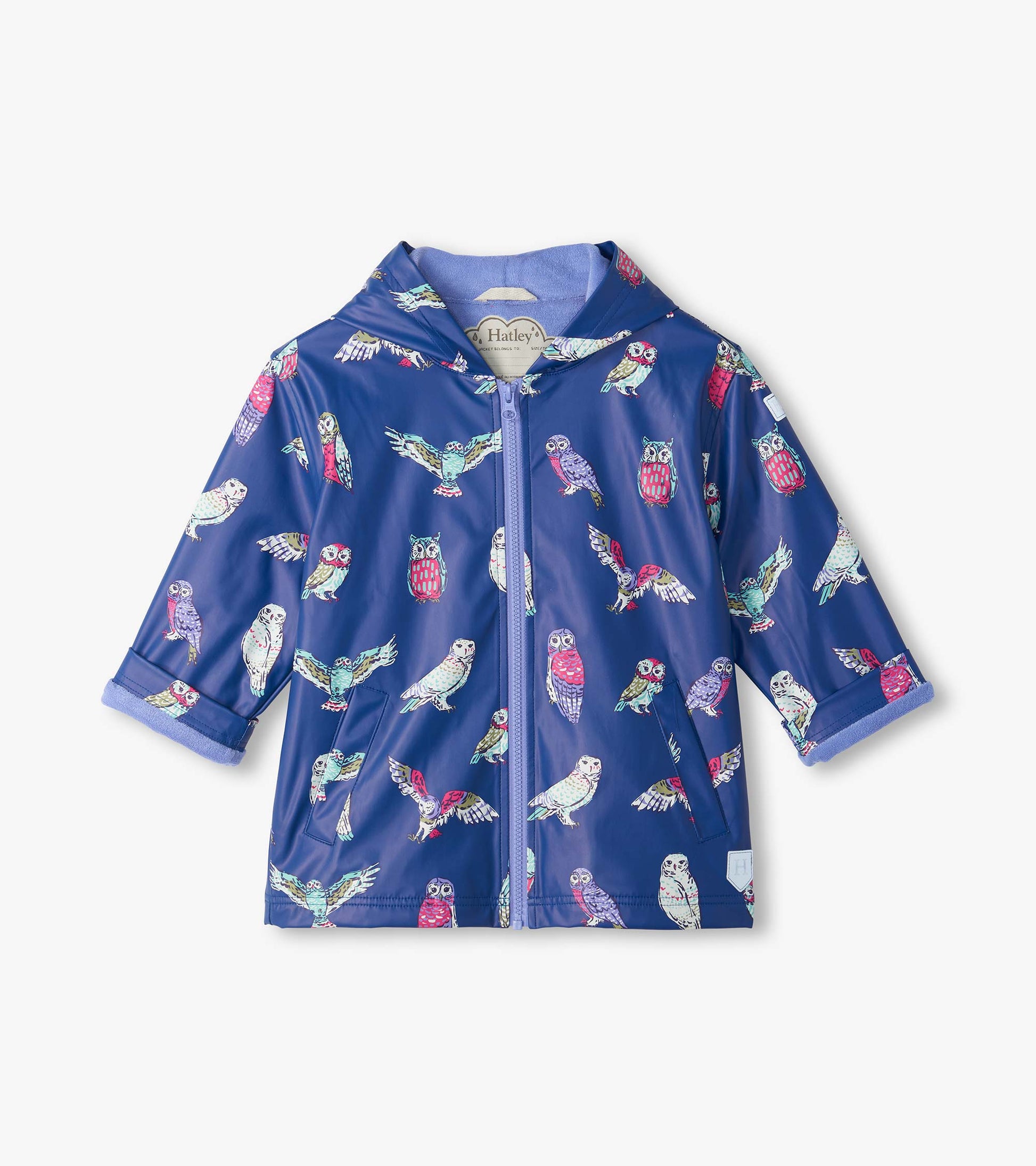Front view of kids' blue hooded rain coat with colorful owl print, zip front, patch pockets, and rolled cuffs