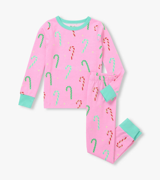 Pink girls pajama set with candy cane print, long-sleeve top, fitted pants, and mint cuffs