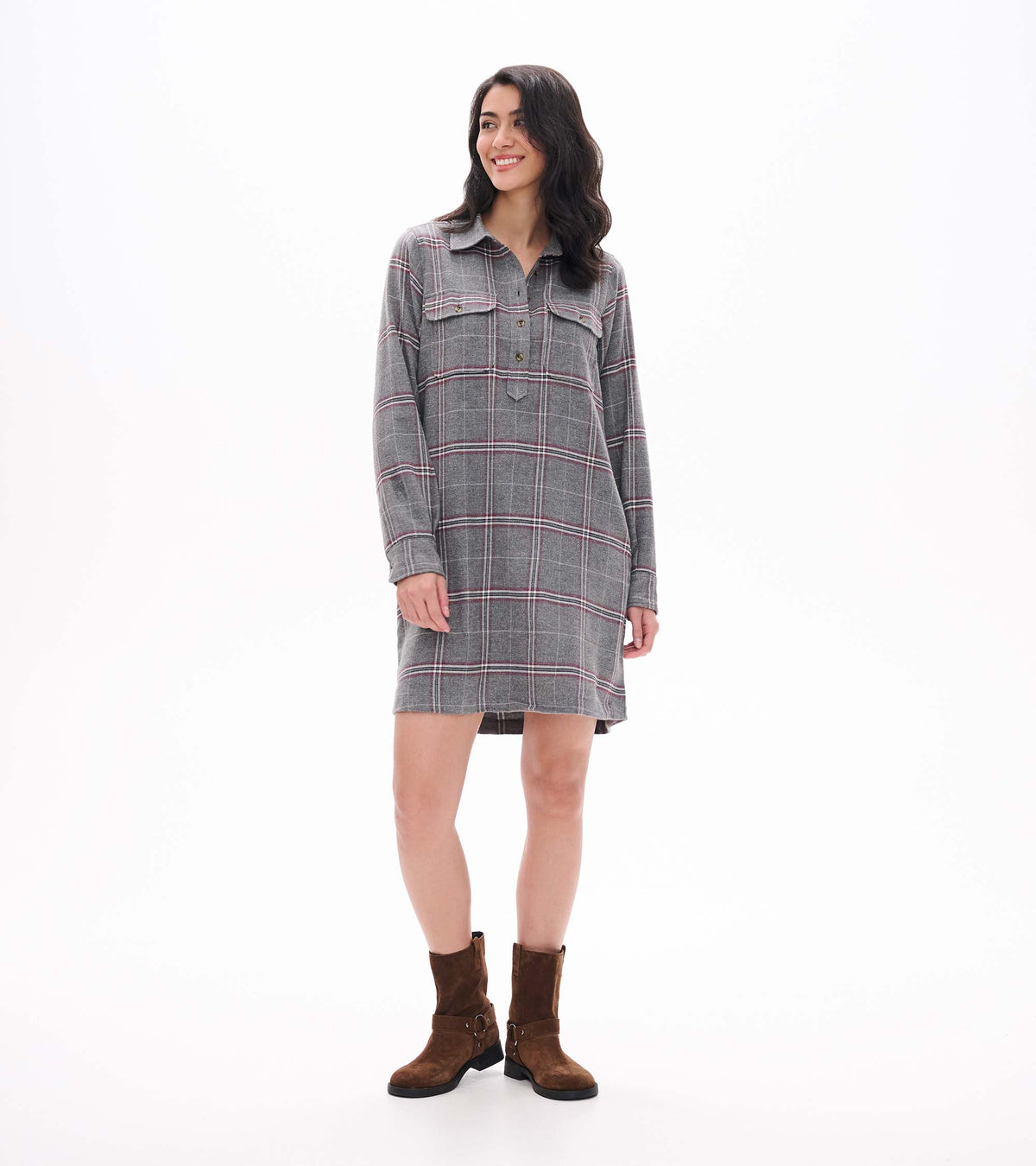 Front view of gray plaid popover dress with long sleeves, collar, chest pockets, and button placket