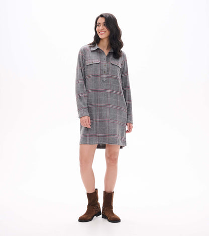 Front view of gray plaid popover dress with long sleeves, collar, chest pockets, and button placket