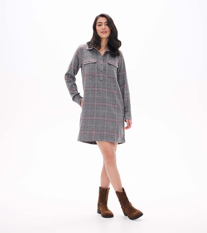 Front angled view of gray plaid popover dress with long sleeves, collar, chest pockets, and side pockets