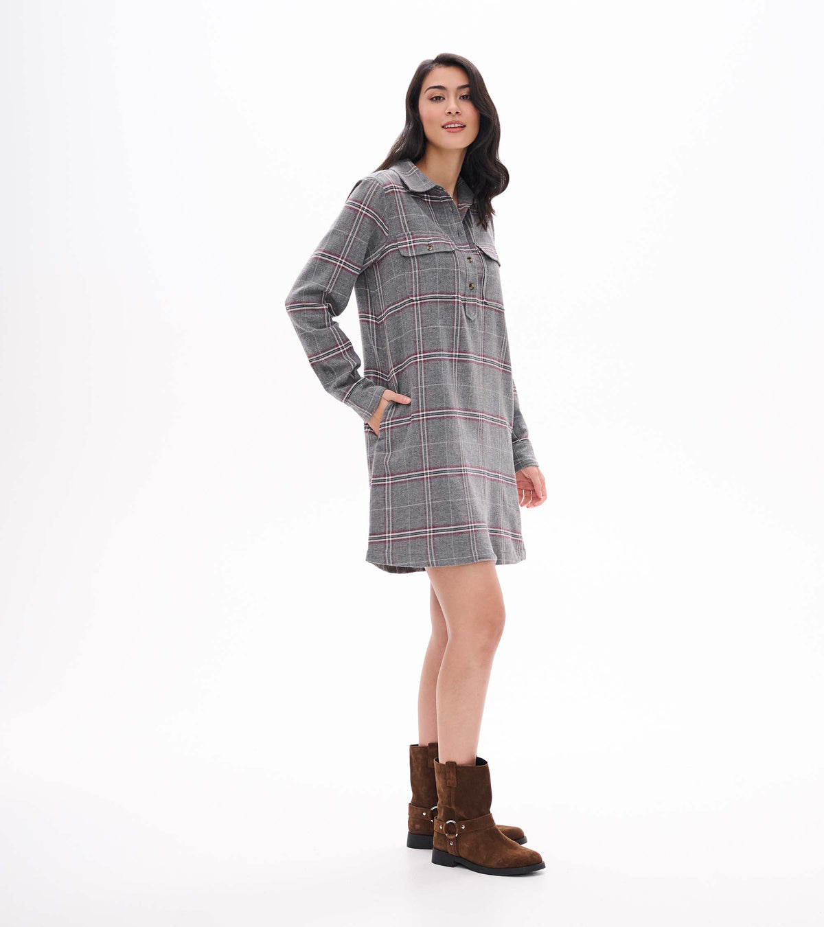 Side view of gray plaid popover dress with long sleeves, collar, chest pockets, and side pockets