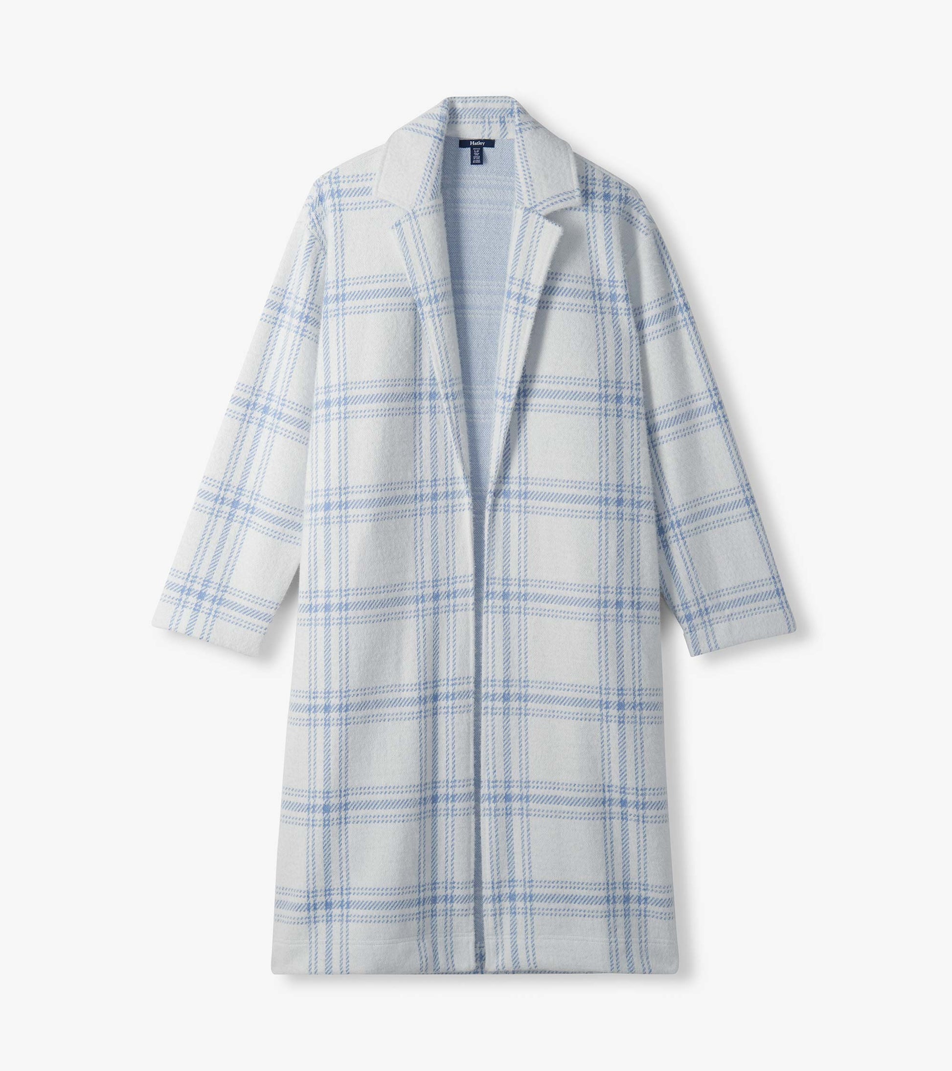 Flat lay of long white jacket with light blue plaid and open front