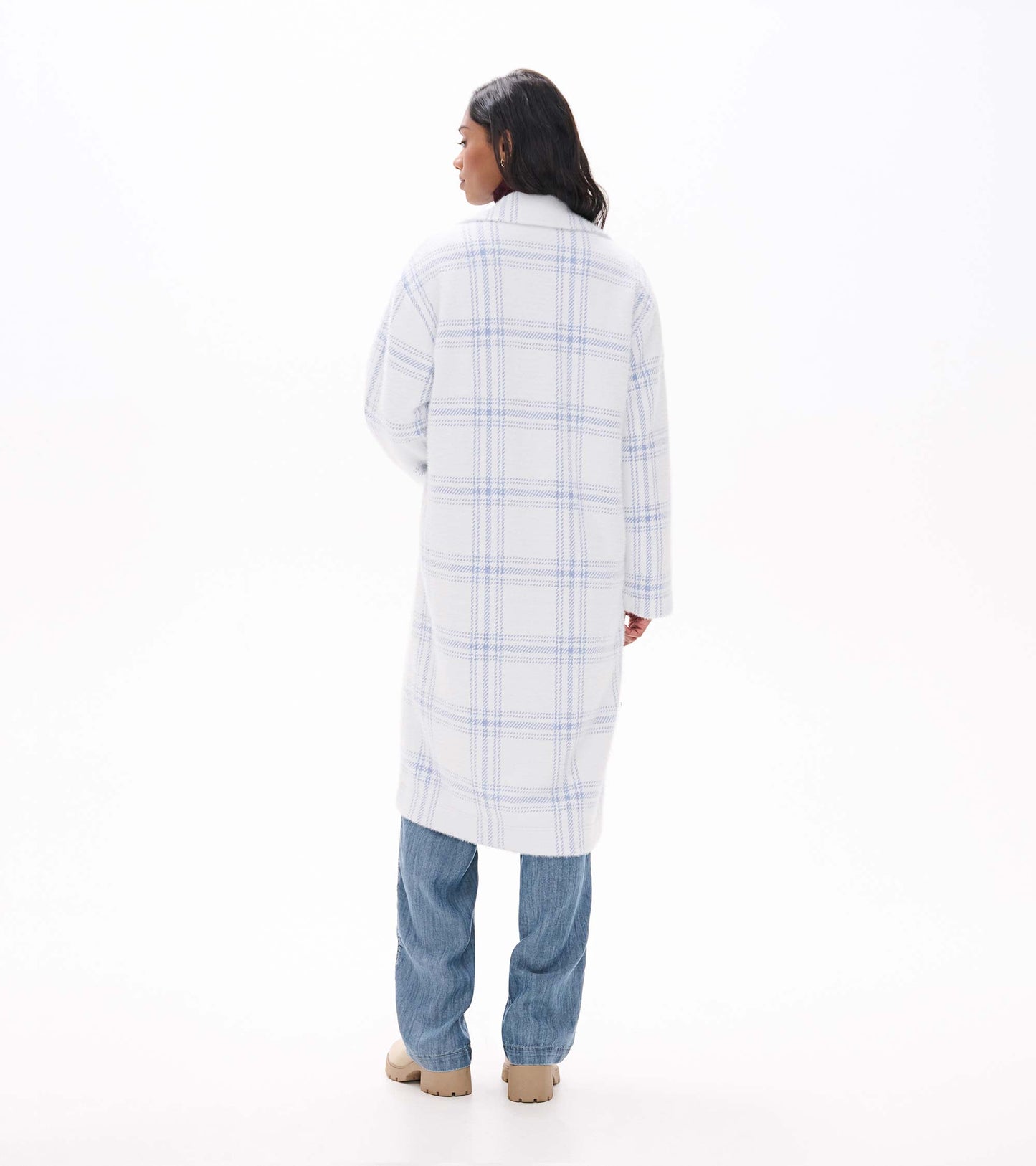 Back view of long white jacket with light blue plaid pattern