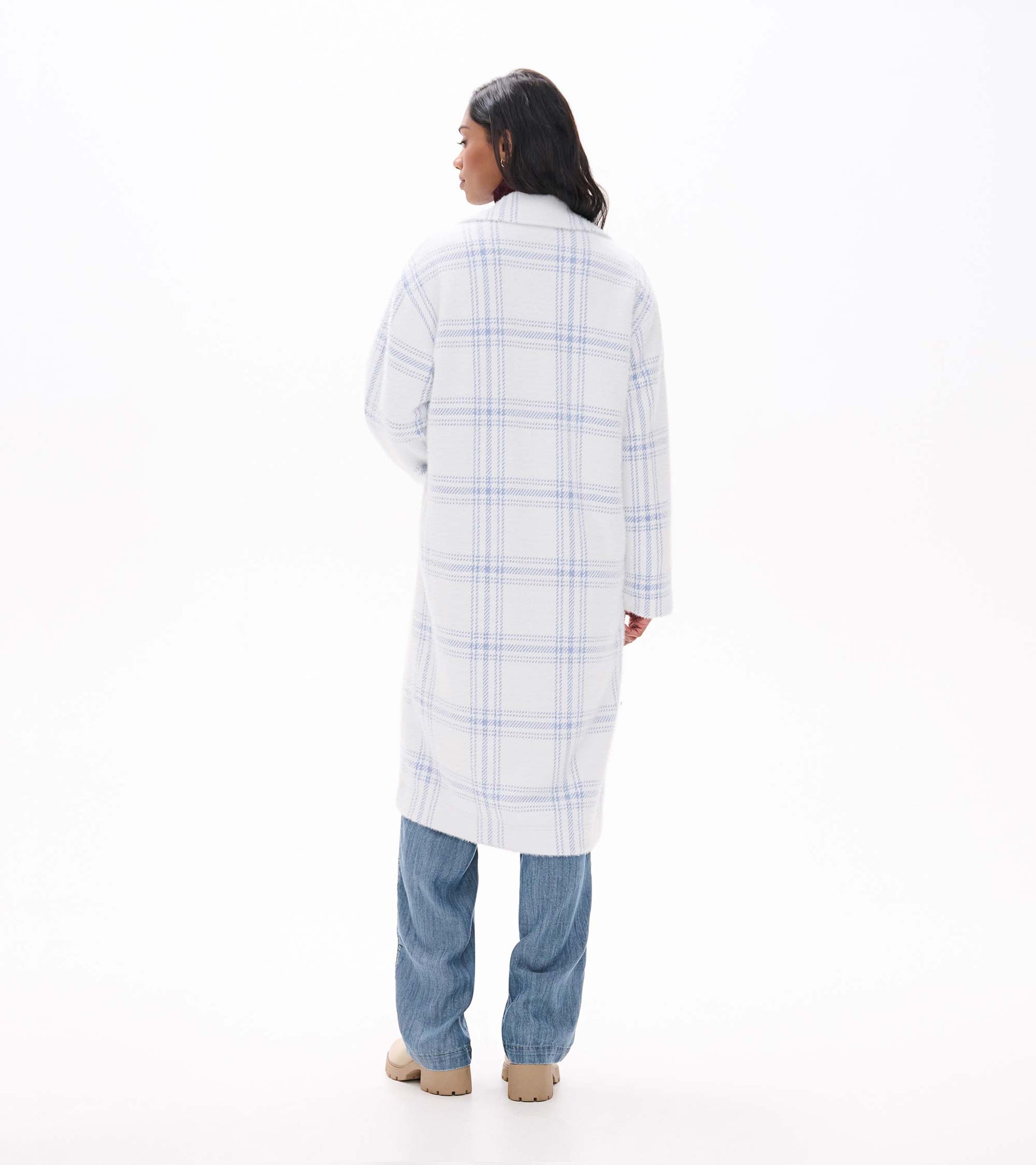 Back view of long white jacket with light blue plaid pattern