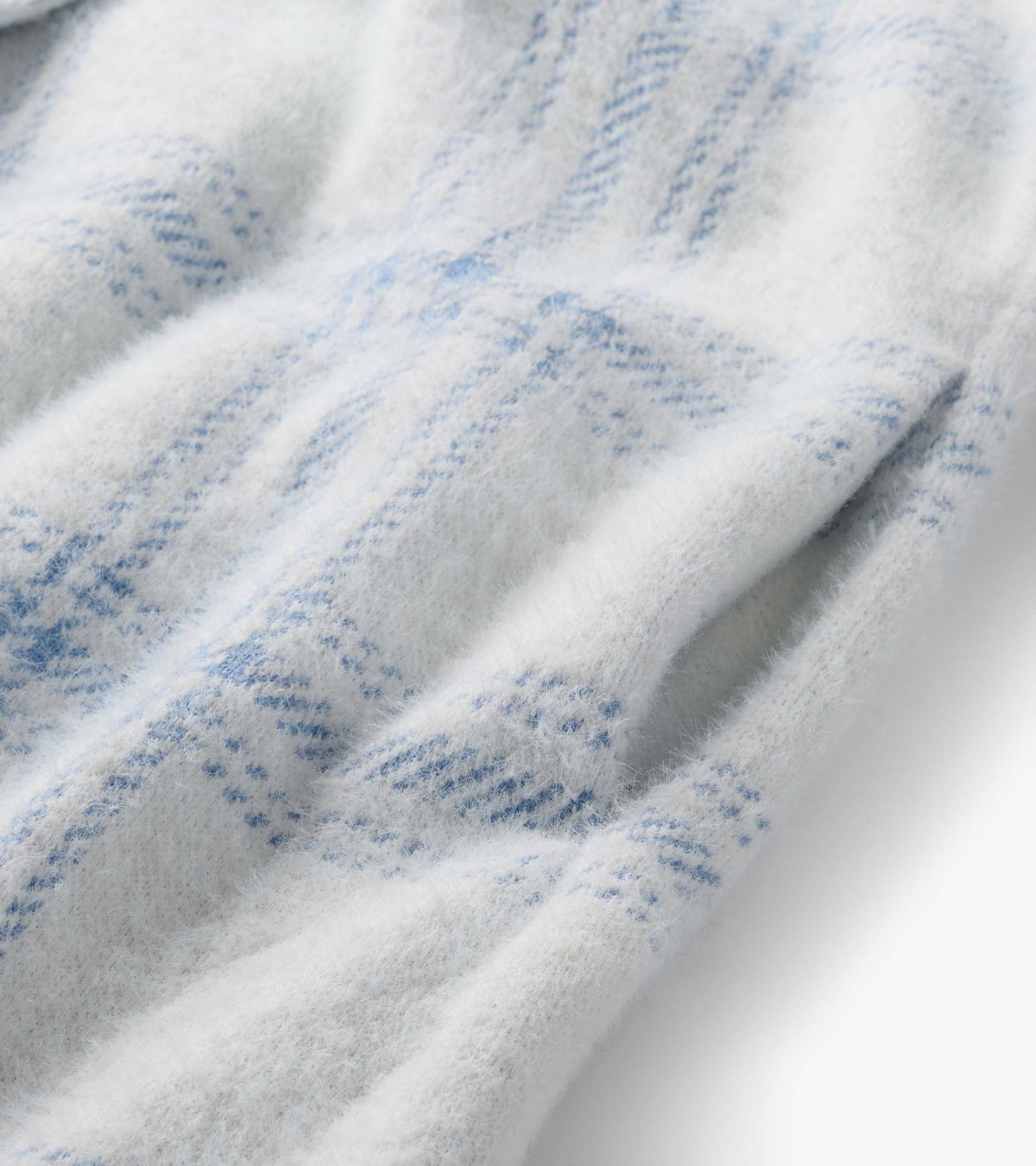 Close-up of white brushed fabric with light blue plaid pattern