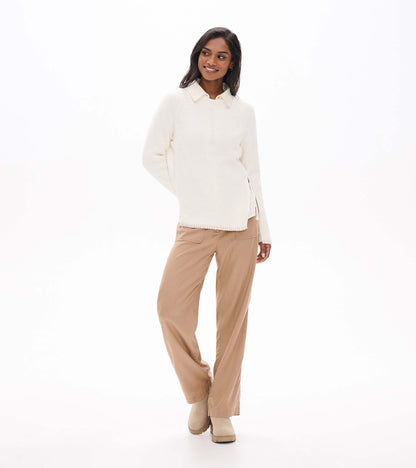 Cream raglan sweater styled over a collared shirt, front view with side zip detail visible