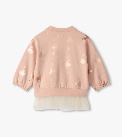 Back view of blush long sleeve top with foil ballerina print and cream tulle hem