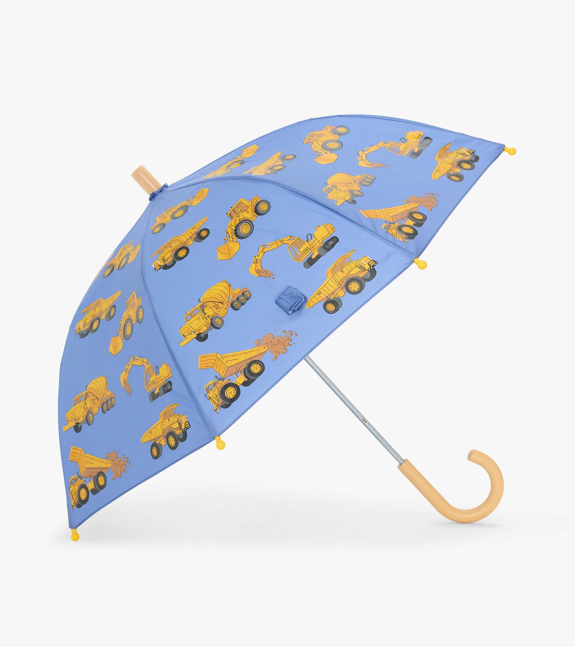 Open blue kids umbrella with yellow construction truck print and curved light wood-tone handle