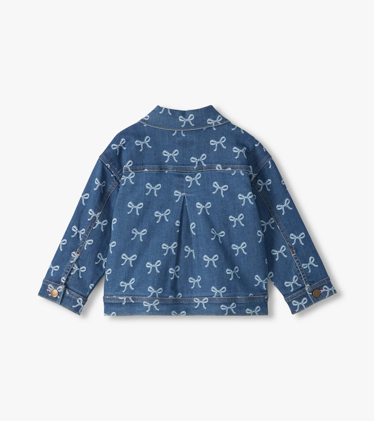 Back view of blue slouchy denim jacket with allover white bow print and pleated back detail