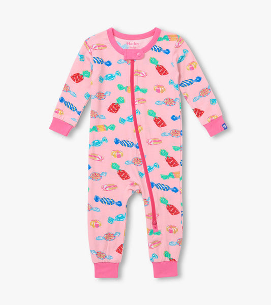 Front view of pink infant coverall with colorful candy print, zipper closure, and bright pink cuffs