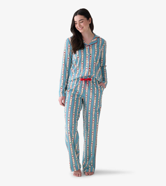 Women's two-piece holiday pajama set with blue striped print and red bow waist, shown on model