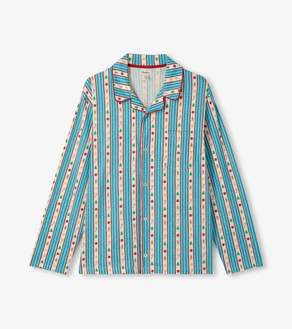 Close-up of pajama shirt with teal holiday stripe print, red piping, chest pocket, and button front