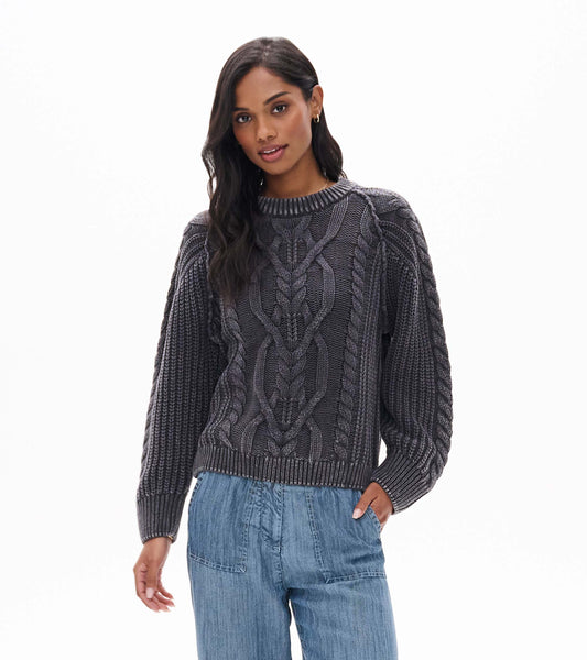 Dark shadow cable knit sweater with crew neck and ribbed cuffs, shown from the front on a model