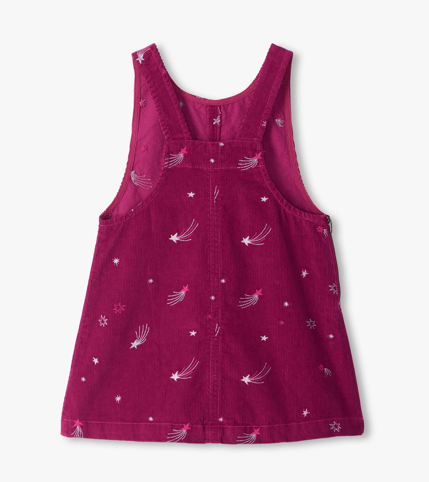 Back view of magenta pinafore dress with racerback straps and embroidered star and shooting star pattern